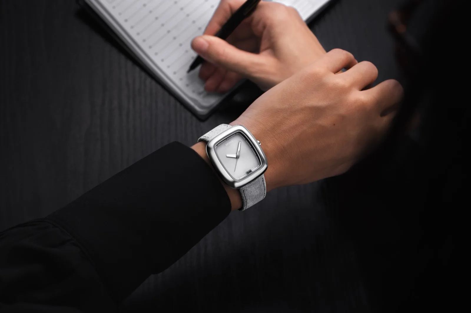 The SN 2140 in natural titanium worn on the wrist